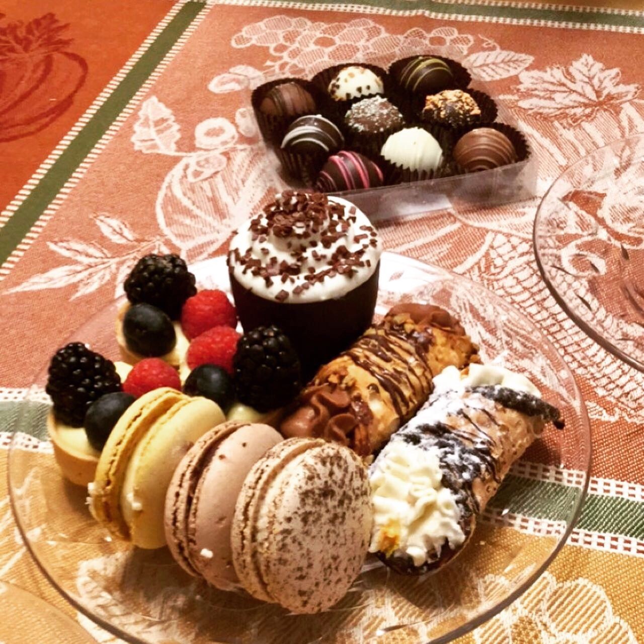 close up of treats Close up of treats for high tea: macaroons, pastries, miniature tarts, a box of assorted truffles