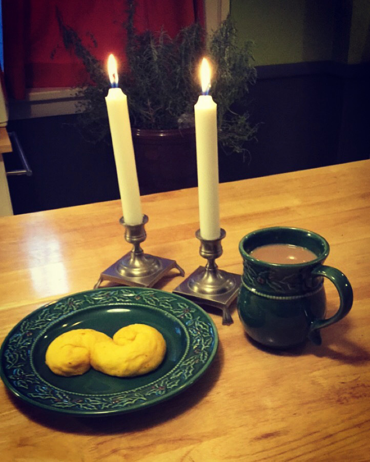 Lussekatter and coffee with candlelight on St. Lucia day 2020